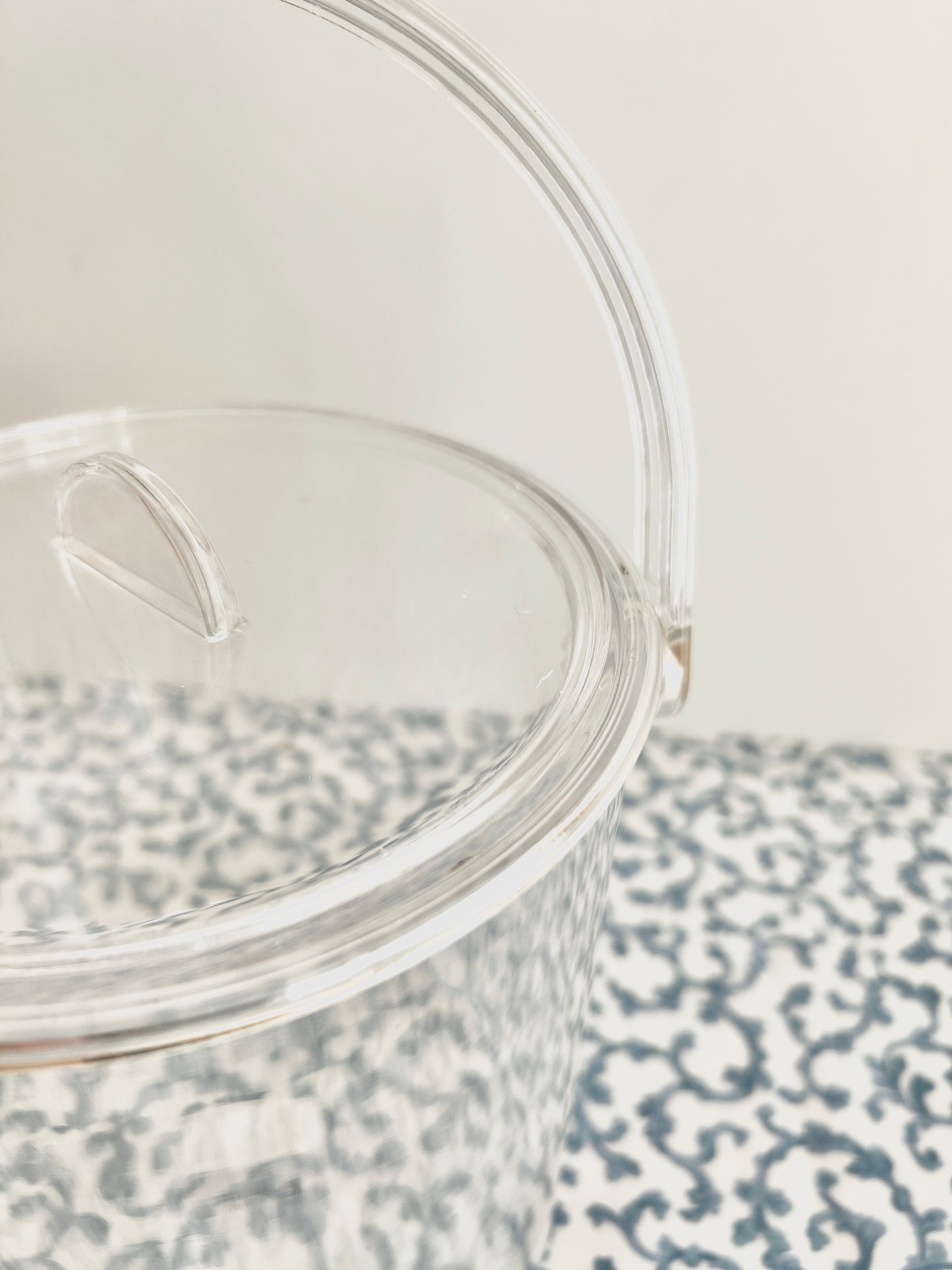 Close up of acrylic ice bucket with room for needlepoint.