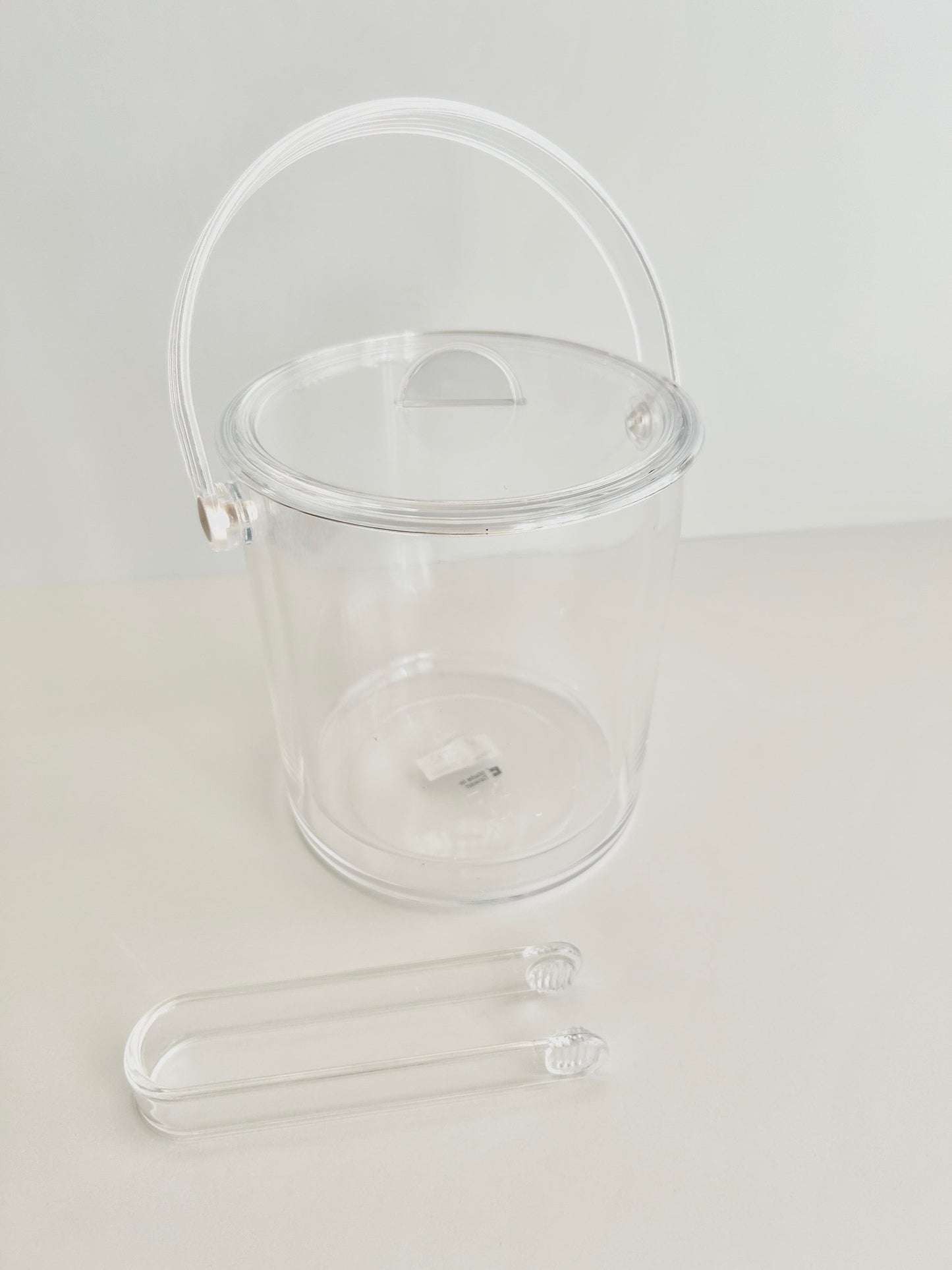Acrylic double walled ice bucket on white background.