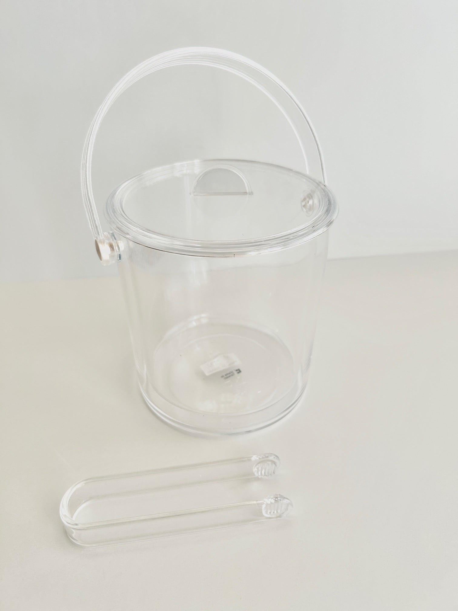 Acrylic double walled ice bucket on white background.
