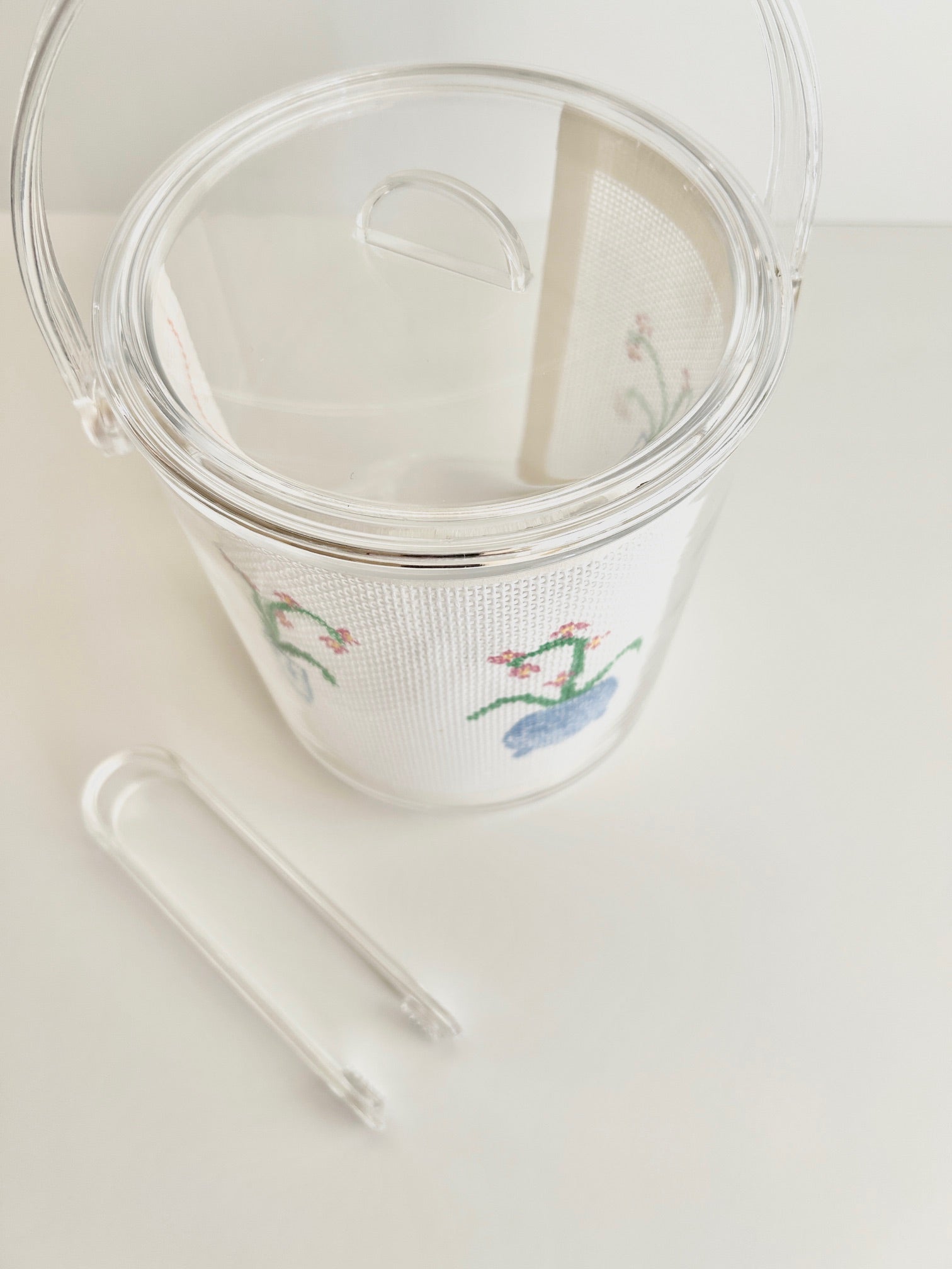 Acrylic ice bucket with needlepoint example.