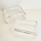 Two clear acrylic boxes for needlepoint with a white background