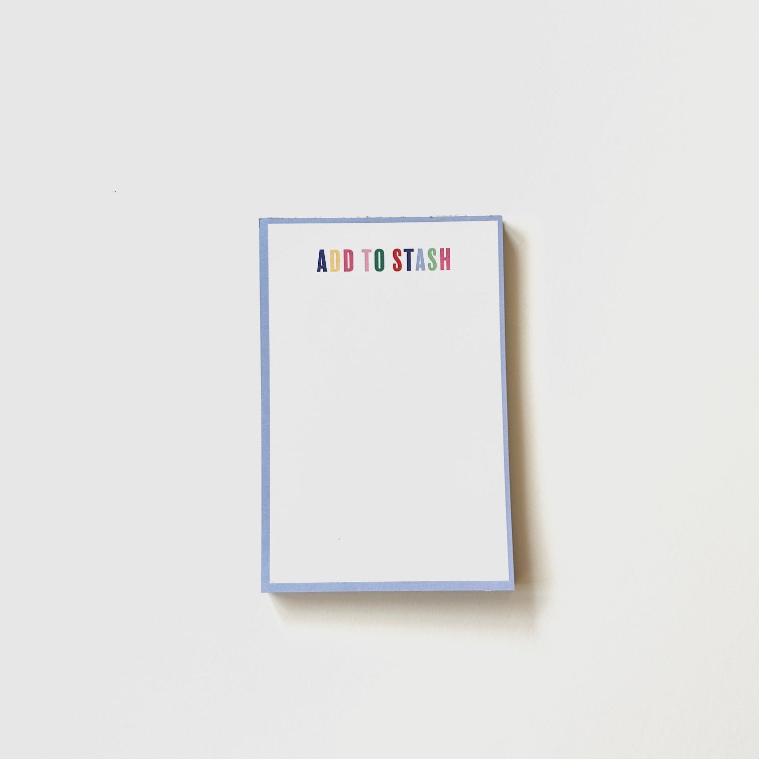 Notepad with 'ADD TO STASH' text on a white background