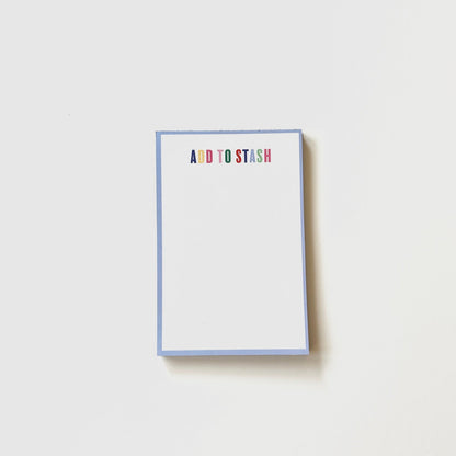 Notepad with 'ADD TO STASH' text on a white background