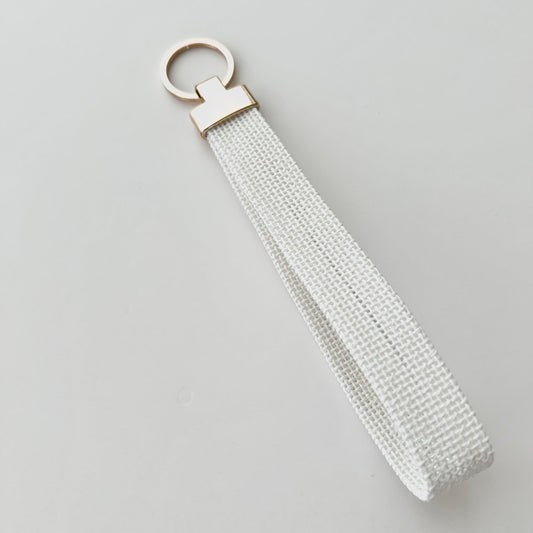 Blank keychain with gold hardware on a white background.