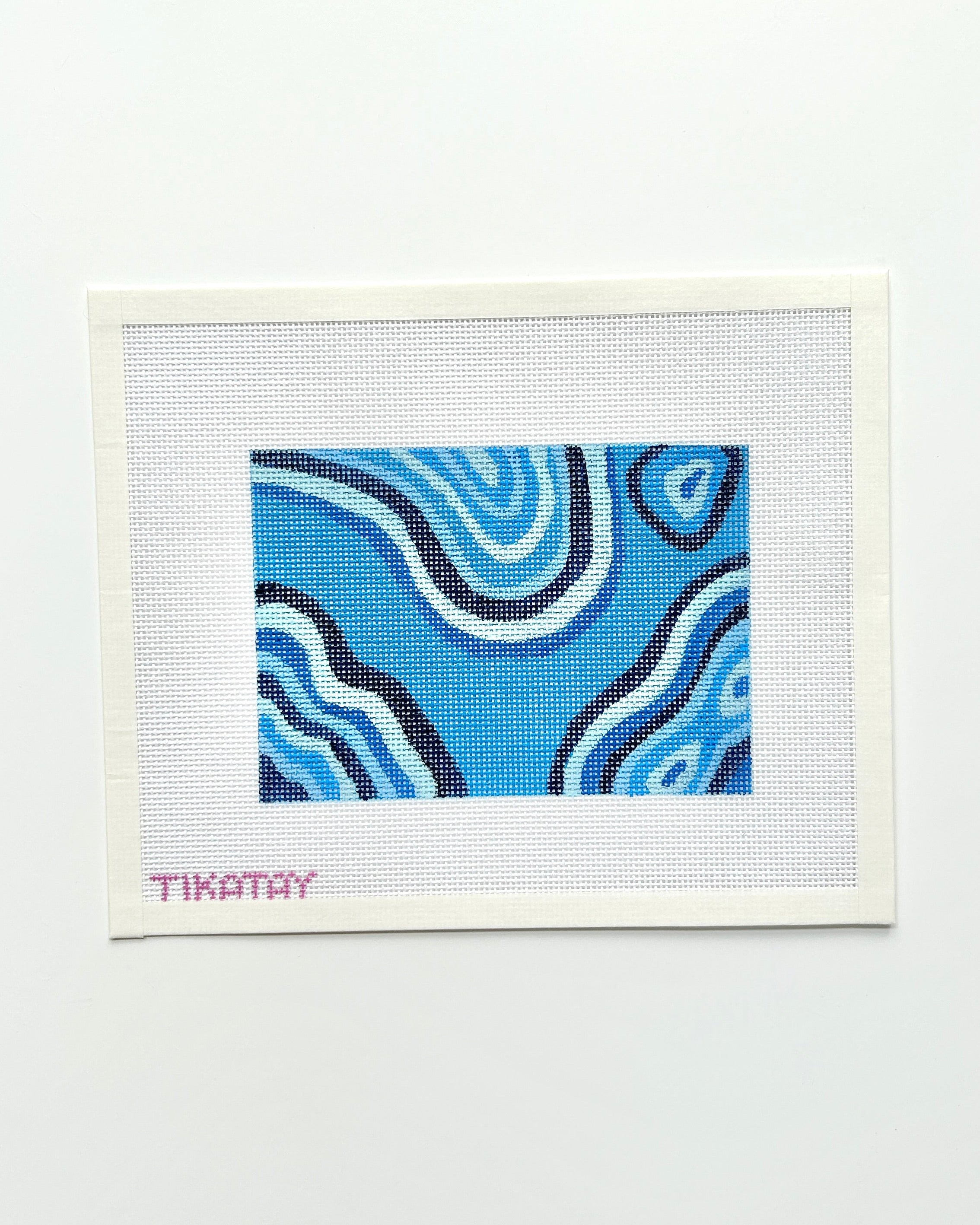 blue malachite needlepoint canvas on white background