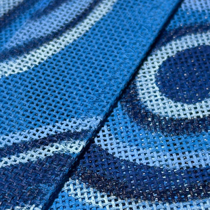 Close-up of blue fabric with hand-painted blue malachite pattern