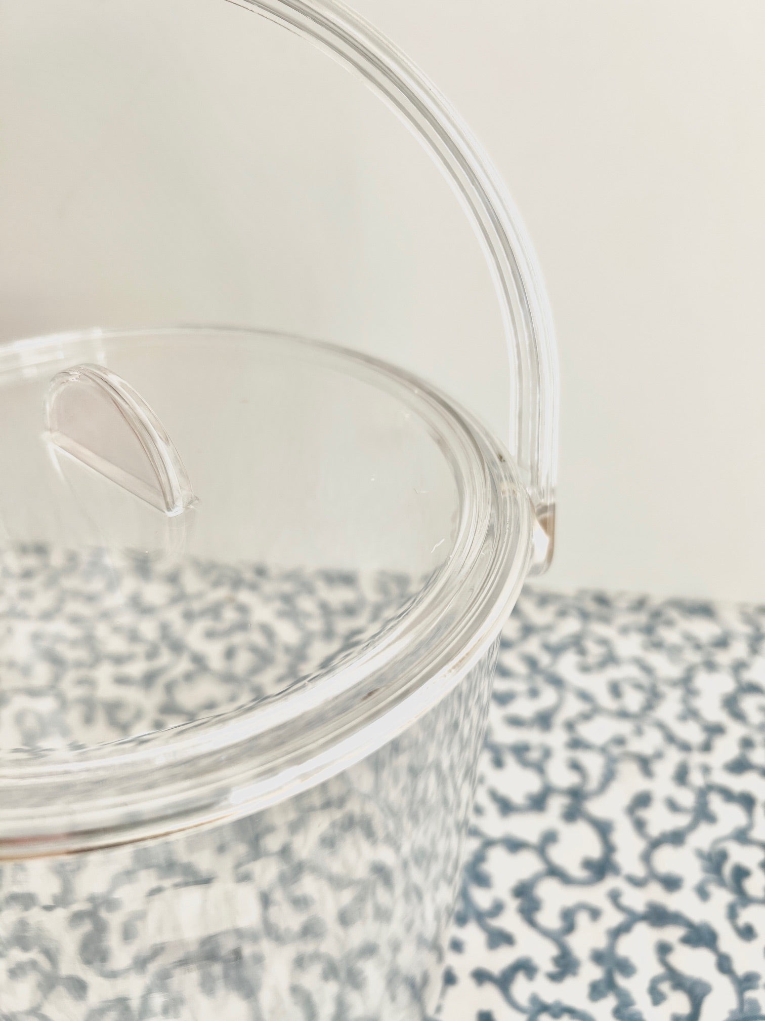 Close up of acrylic ice bucket with room for needlepoint.