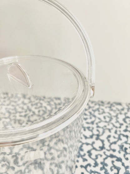Close up of acrylic ice bucket with room for needlepoint.