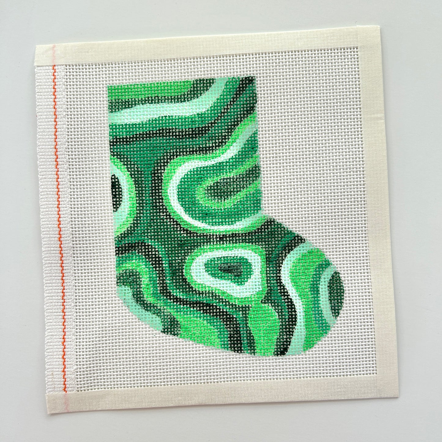 Malachite mini stocking needlepoint canvas on white background.