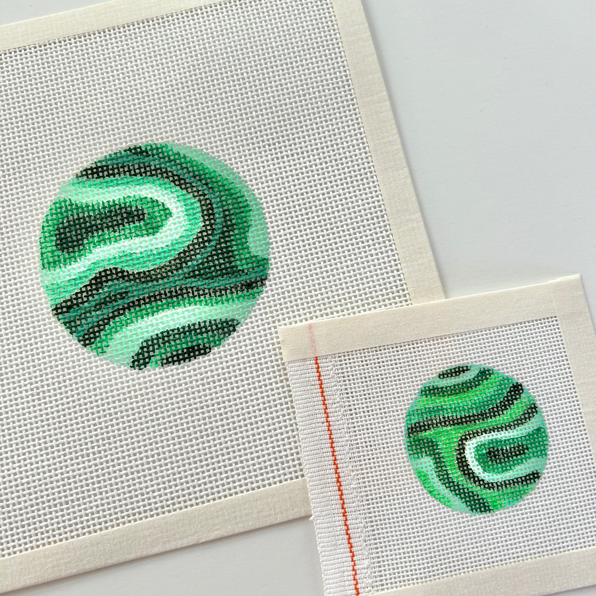 Malachite 3" ornament shown with the 2" bag charm or mini ornament needlepoint canvases.