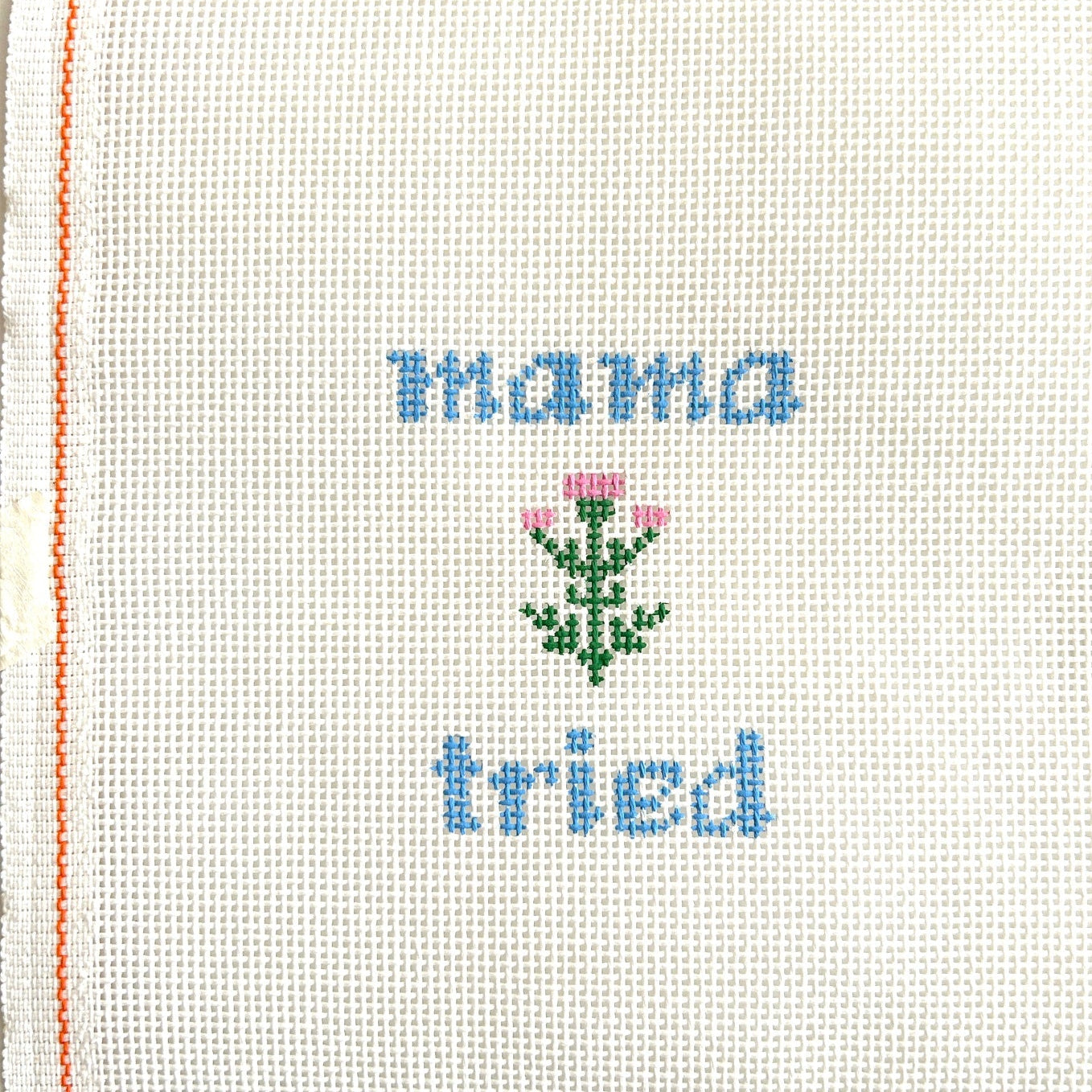 Mama tried needlepoint canvas with pink flower.
