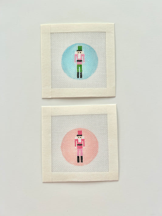 Mini nutcracker round bag charm canvases in pink nd blue.