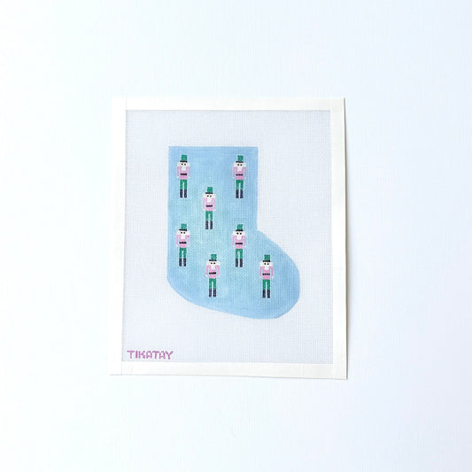 Mini Nutcracker Mini Stocking needlepoint canvas in Blue on white background. 