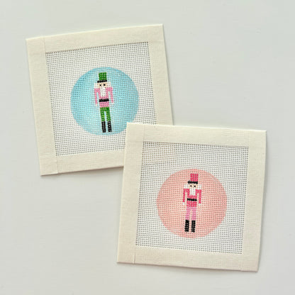 Mini nutcracker bag charm canvas in 18 mesh with pink or blue backgrounds.