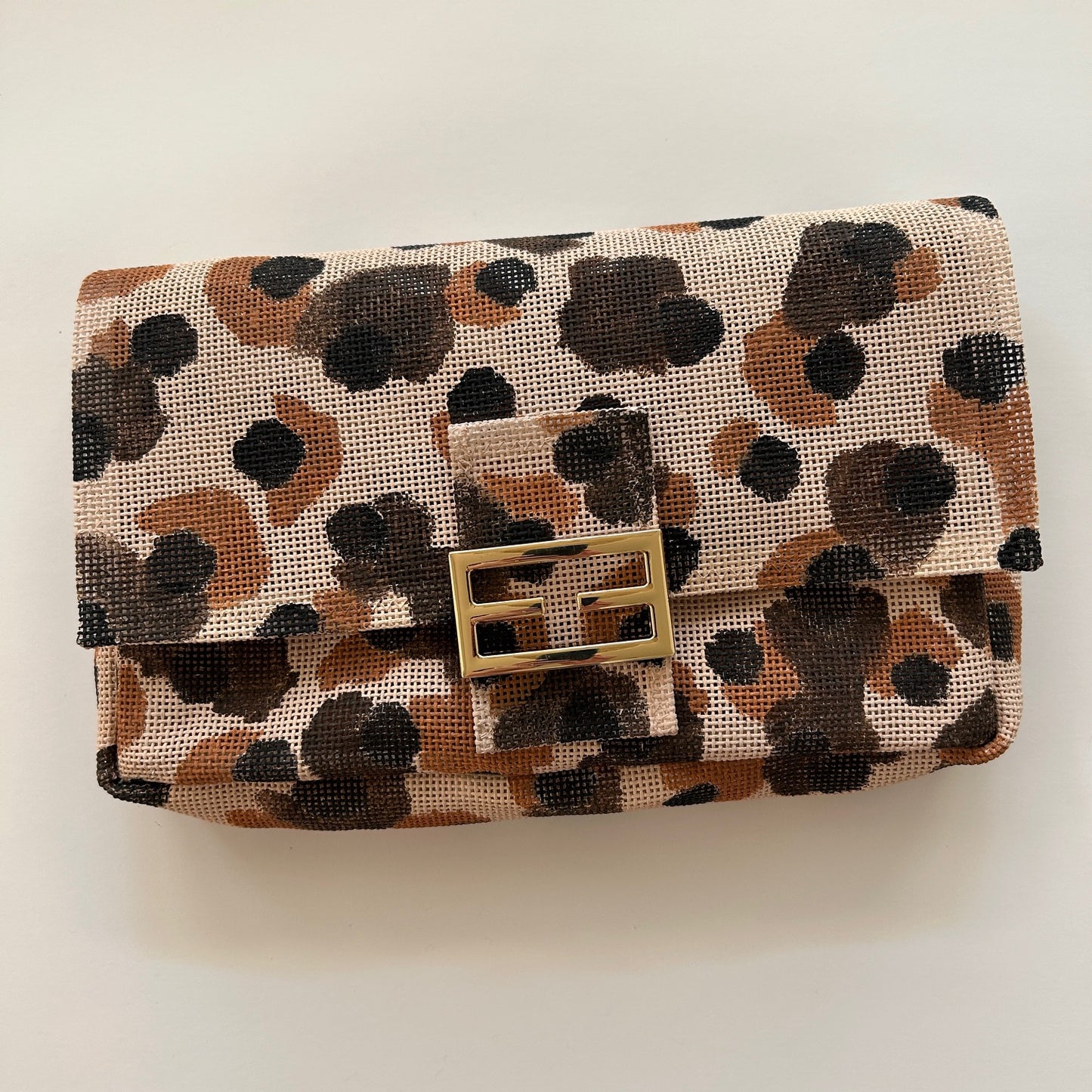 Leopard print needlepoint bag with gold hardware